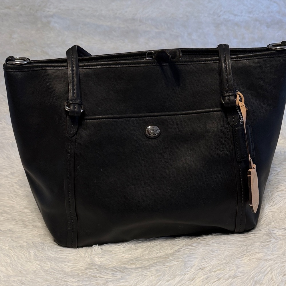 Coach Elegant Black Leather Tote Bag with zipper closure.